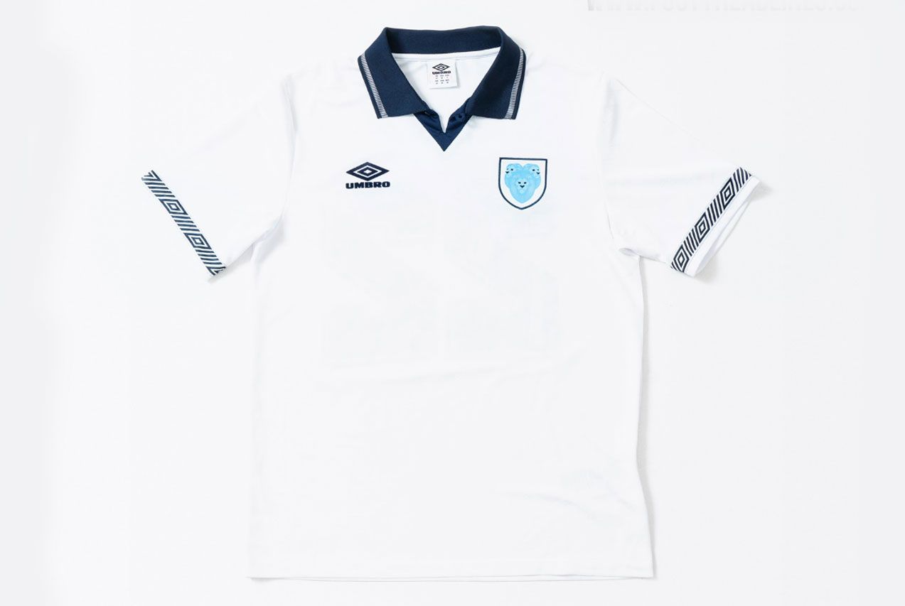 The Nations' Collection by Umbro product image of a white retro England shirt with a navy collar.