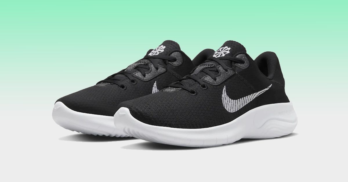 A black knitted pair of running shoes with white soles in front of a green and light grey gradient background.