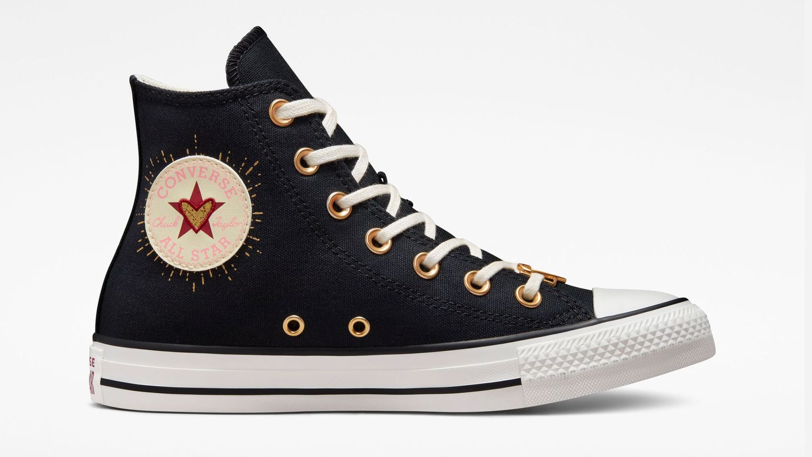 Best sneakers for Valentine's Day - Converse Chuck Taylor All Star "Hearts" product image of a Black and White high-top with Gold and Red heart accents.