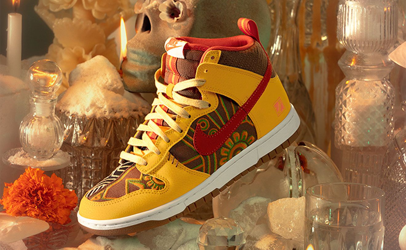 Nike Dunk High "Somos Familia" product image of a brown and orange suede sneaker with a split design to represent salt and water.