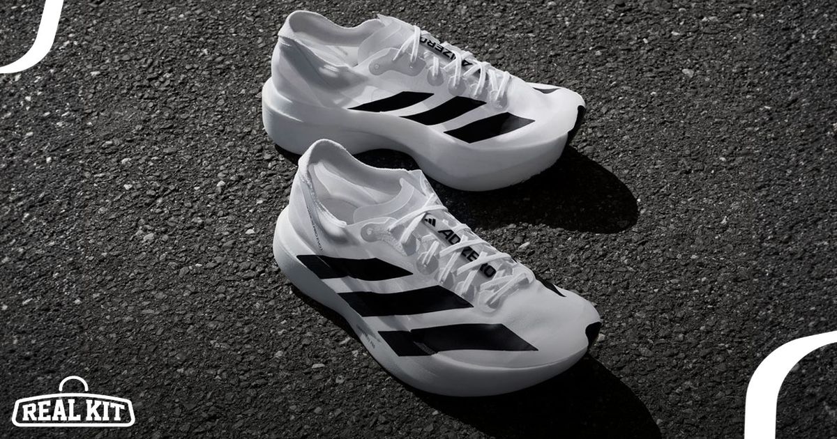 A white pair of adidas running shoes featuring oversize black stripes down the side.