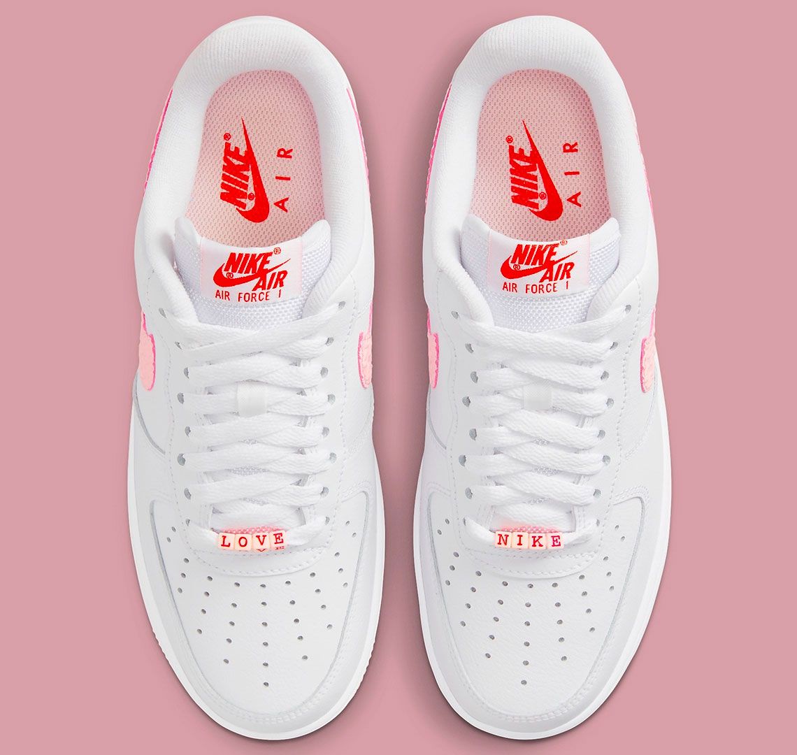 Nike Air Force 1 Valentine's Day product image of white and pink sneakers.