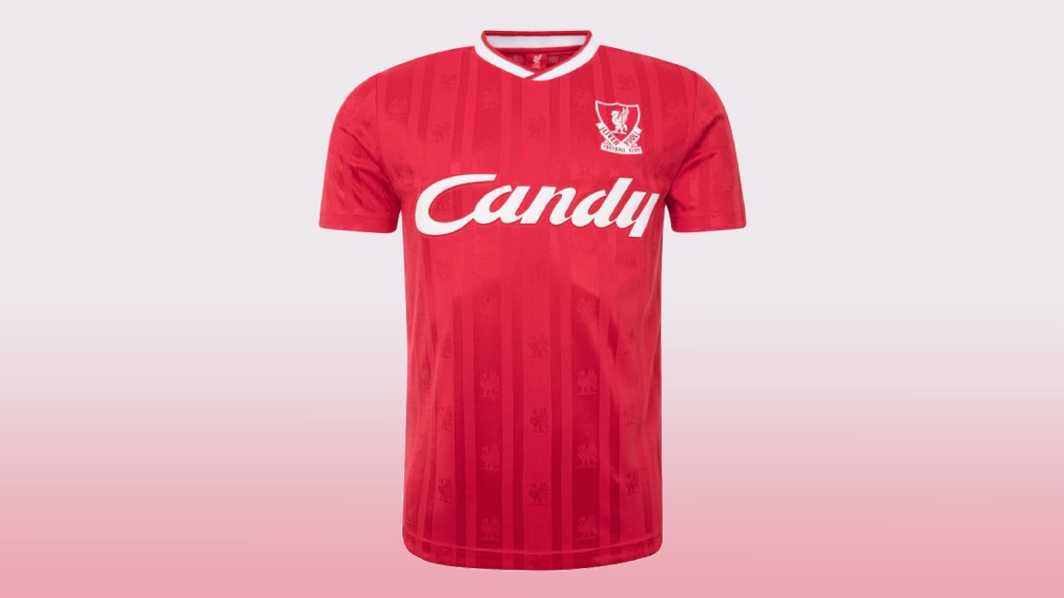 A retro red Liverpool kit with white trim around the collar and Candy branding across the front.
