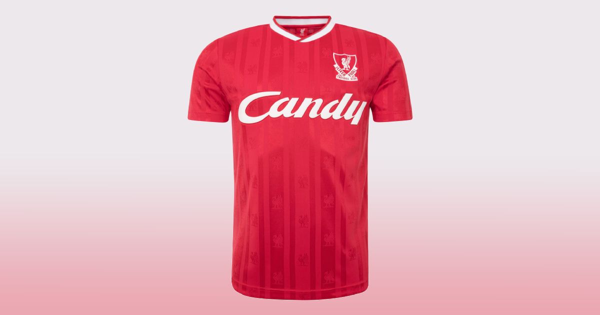 A retro red Liverpool kit with white trim around the collar and Candy branding across the front.