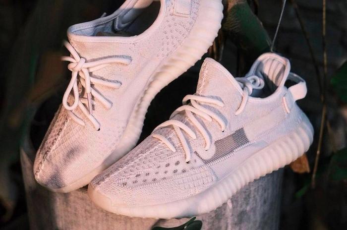 Yeezy Boost "Pure Oat" product image of an all white sneaker.