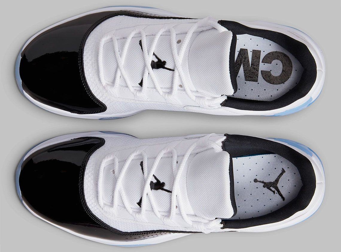 Air Jordan 11 CMFT Low "Concord" product image of a white and black leather sneaker with a translucent blue outsole.