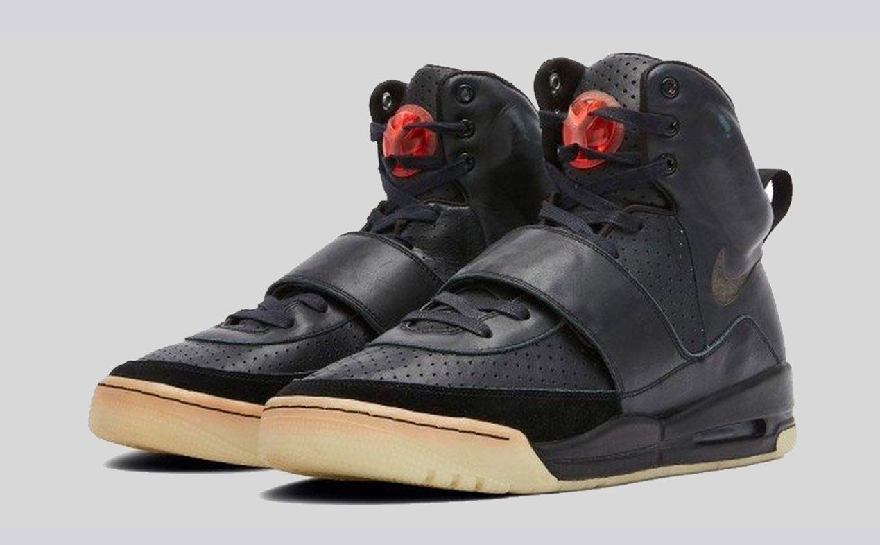 Nike Air Yeezy 1 from 2008 features an all-black colour scheme and a red detail on the tongue.