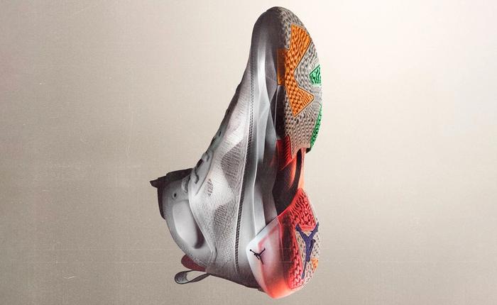 Air Jordan 37 product image of a mesh white sneaker with multi-coloured soles.