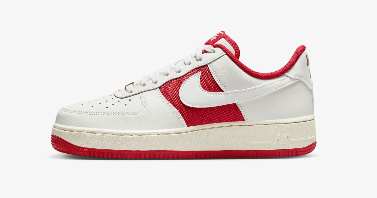 An off-white Air Force 1 featuring a red outsole, trim, and underlayer on the side.