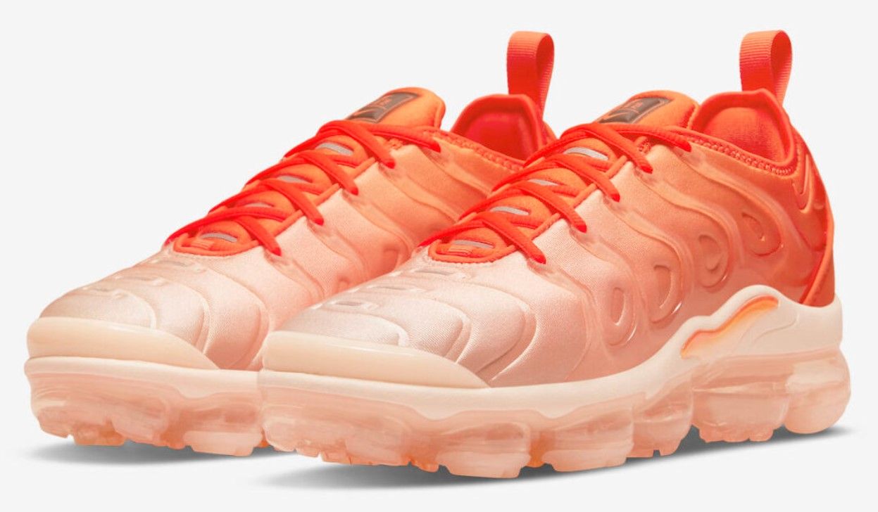 Nike Air VaporMax Plus "Citrus" product image of an orange pair of sneakers faded into light pink.