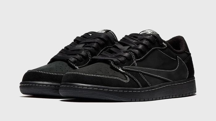 History of the Jordan 1 - Travis Scott x Air Jordan 1 Low "Black Phantom" product image of an all-black pair of low-tops with exposed white stitching.
