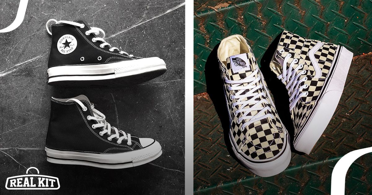 On the left, a pair of black and white Converse high-tops. On the right, a pair of white and black chequered Vans high-tops on a rusted green metal floor.