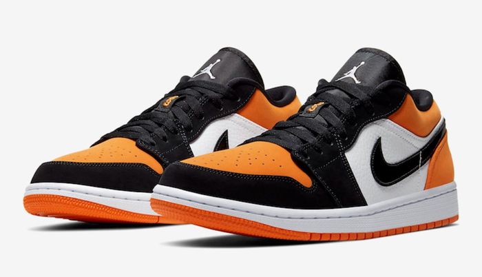 Best Air Jordan 1 Low "Shattered Backboard" product image of a pair of white, black, and orange sneakers.