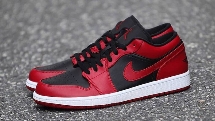 Best Air Jordan 1 Under 200 "Reverse Bred" product image of a pair of black and red sneakers.
