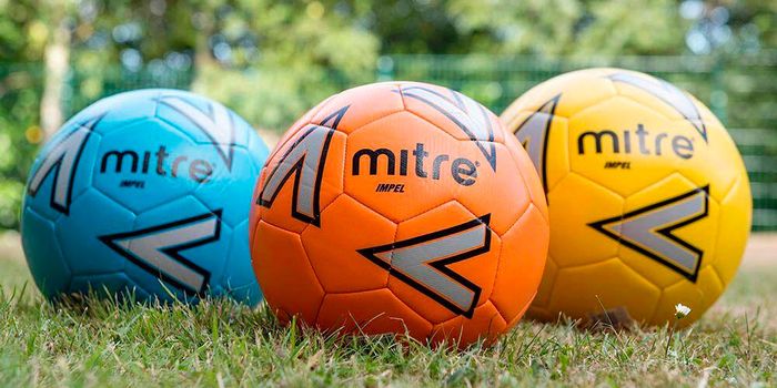 Best footballs Mitre product image of three footballs in blue, orange, and yellow.