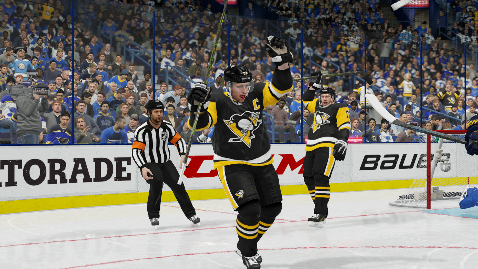 Penguins players celebrate a goal in NHL 22.