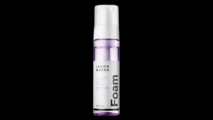 Best leather cleaner for shoes - Jason Markk Ready To Use Foam product image of a clear bottle with white branding and a light purple liquid inside.