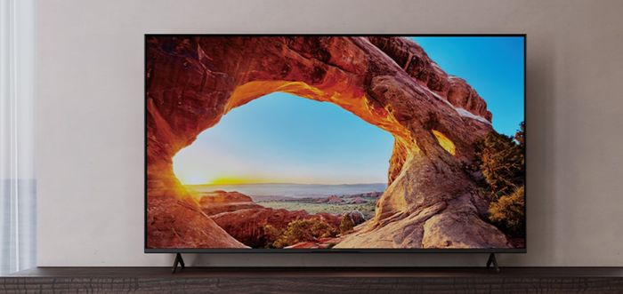 4K TV with mountains on its display.