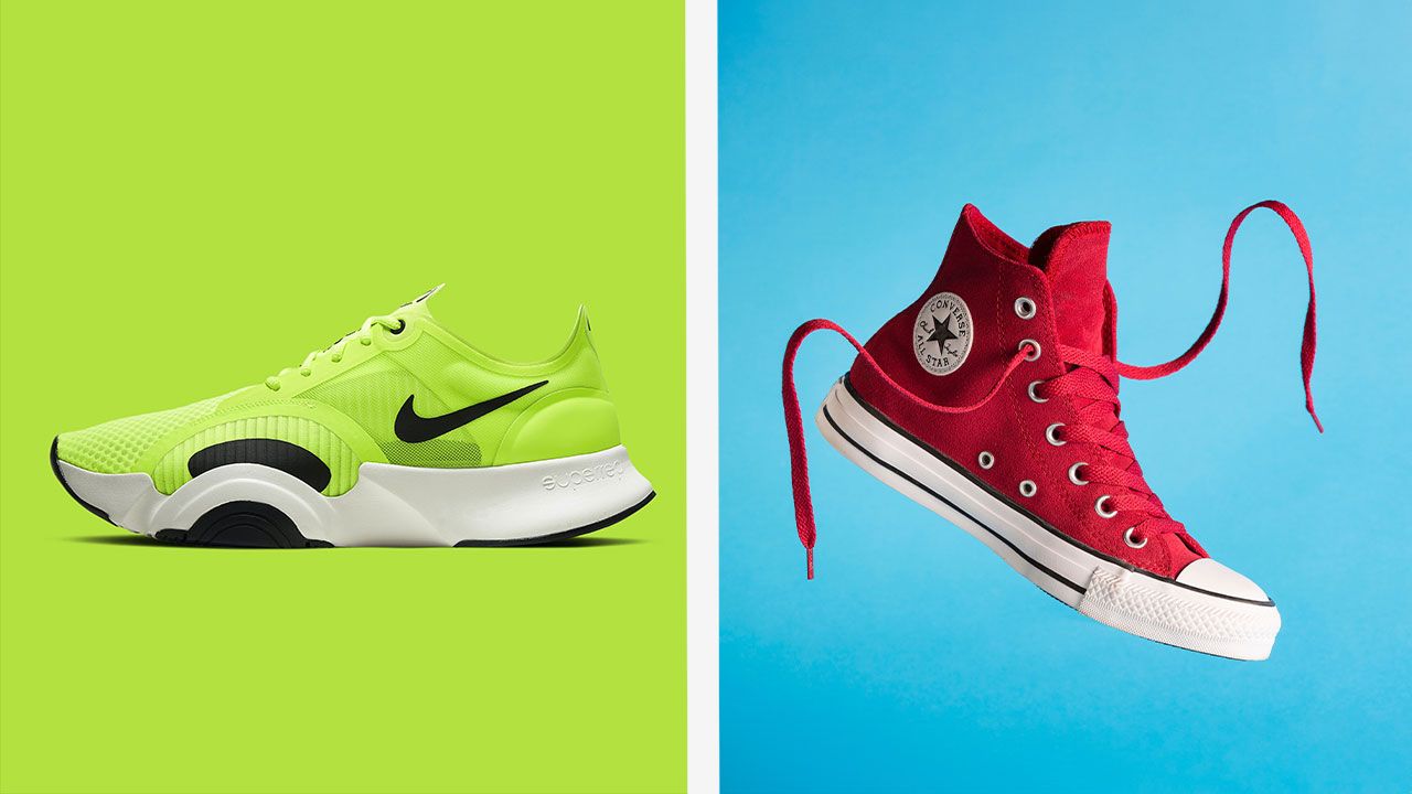 On one side of a white line, and lime green Nike running shoe with a white midsole and black Swoosh down the side. On the other, a red and white Converse high-top with its laces untied.