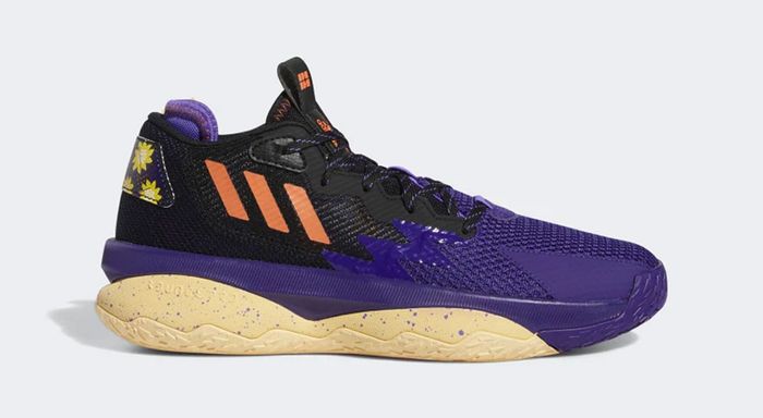Best basketball shoes adidas product image of a purple and black sneaker with orange accents and a cream midsole.