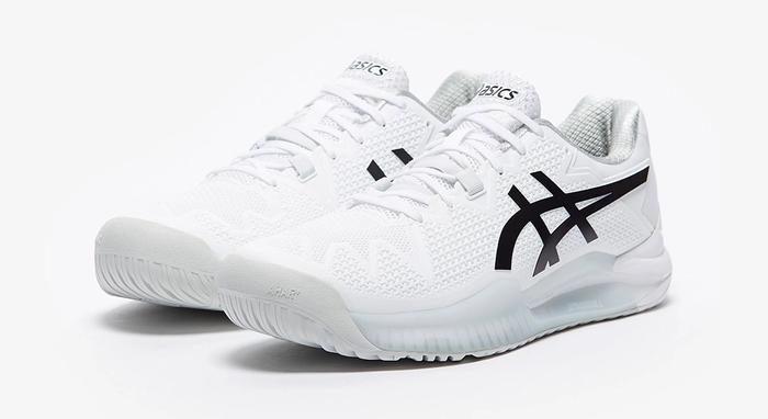Best tennis shoes ASICS product image of a white pair of sneakers with black details.