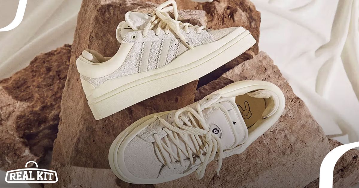 Image of a pair of off-white adidas Campus Light sneakers on top of a brown pile of brick.