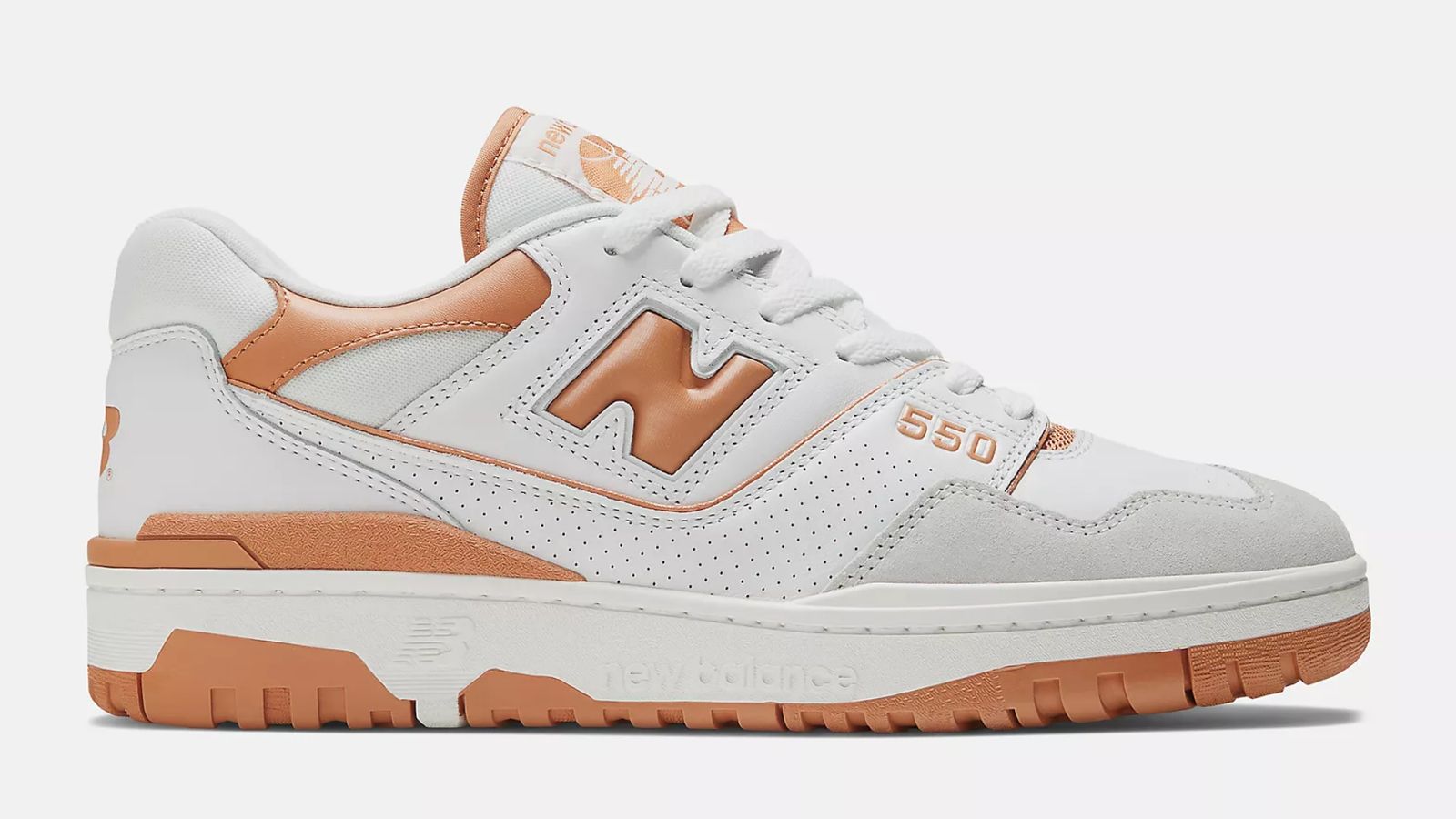 New Balance 550 product image of a white and grey shoe with sepia accents.