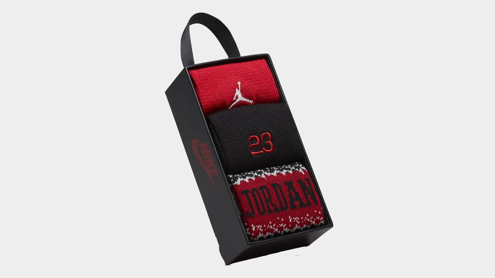 Jordan MJ Holiday Crew Socks product image of a black box with red, black, and dark red socks inside.