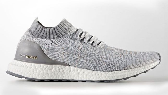 adidas Ultraboost Uncaged product image of a light grey knitted sneaker with a white Boost midsole.