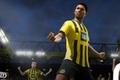 In-game FIFA 23 image of Jude Bellingham wearing a yellow and black striped Dortmund kit.