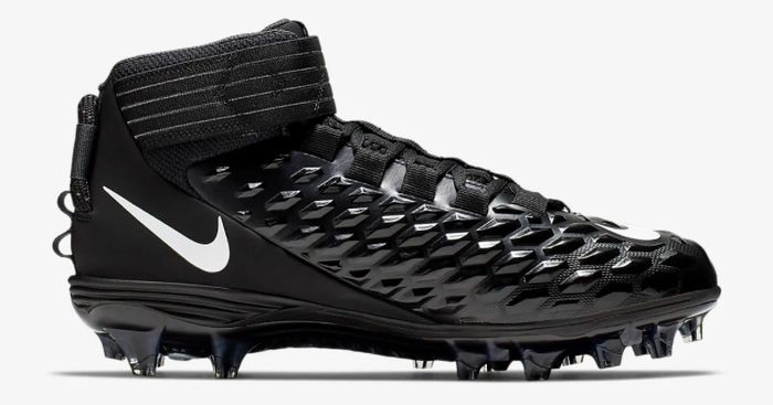 Best football cleats under 100 Nike product image of a singular black and white cleat.