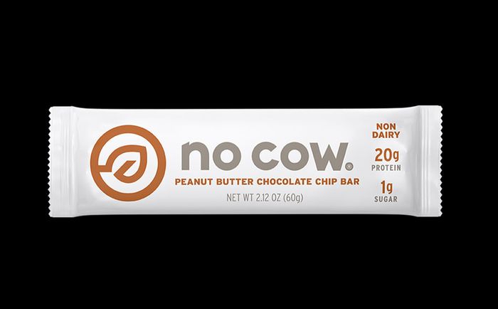 Best vegan protein bars Now Cow product image of a white packaged peanut butter chocolate chip protein bar.
