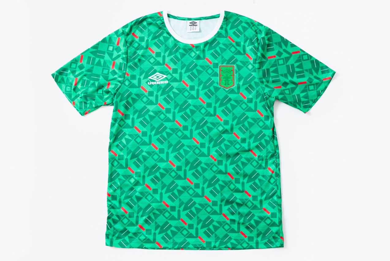 The Nations' Collection by Umbro product image of a green retro Mexico shirt with a red geometric pattern all over.