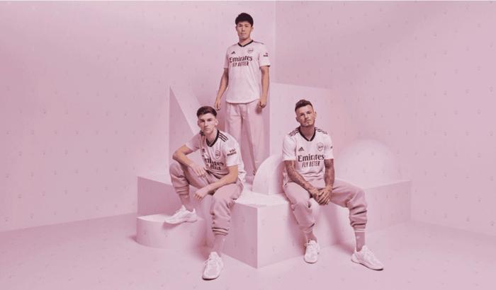 Arsenal adidas third kit product image of a pink strip with navy trim.