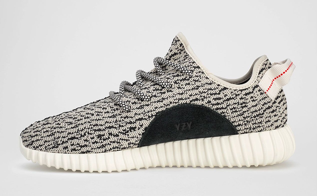 adidas Yeezy 350 "Turtle Dove" product image of a white and black knitted Boost sneaker.