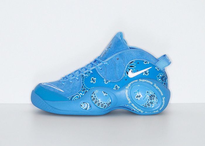 Supreme x Nike Zoom Flight 95 product image of a blue sneaker with a bandana-like pattern across the side and red hang tag.