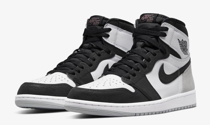 Best Air Jordan 1 Colorways "Stage Haze" product image of a pair of white and black sneakers with grey suede details.