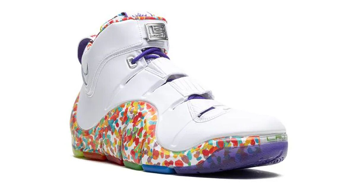 A white sneaker with colorful spots above the outsole to replicate Fruity Pebbles.