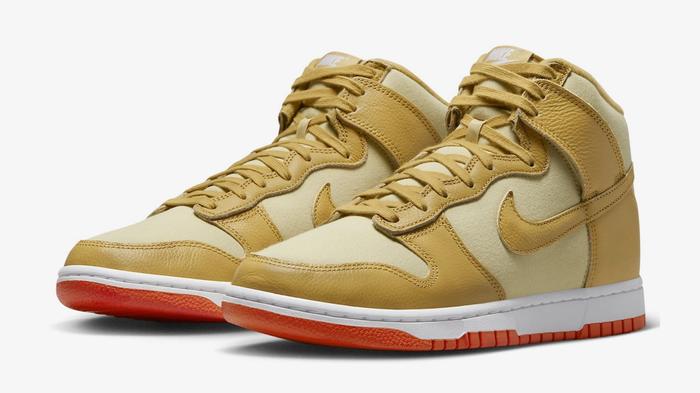 Nike Dunk vs SB Dunk - Nike Dunk High "Gold Canvas" product image of a Team Gold and Wheat Gold pair of high-tops with orange outsoles.