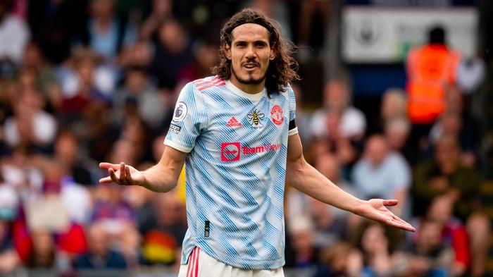 Best Manchester United kits adidas 2021/22 image of the Cavani wearing a white and blue patterned kit with bright red details.