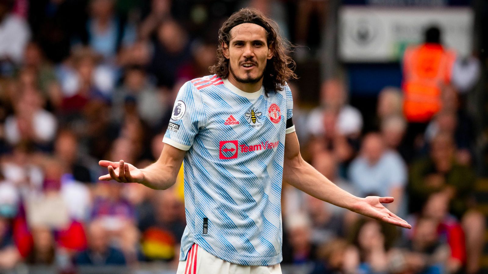 Manchester United adidas 2021/22 kit image of the Cavani wearing a white and blue patterned kit with bright red details.