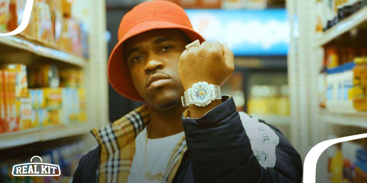 Image of A$AP Ferg wearing a bright white G-SHOCK watch along with an orange hat and black Burberry jacket.