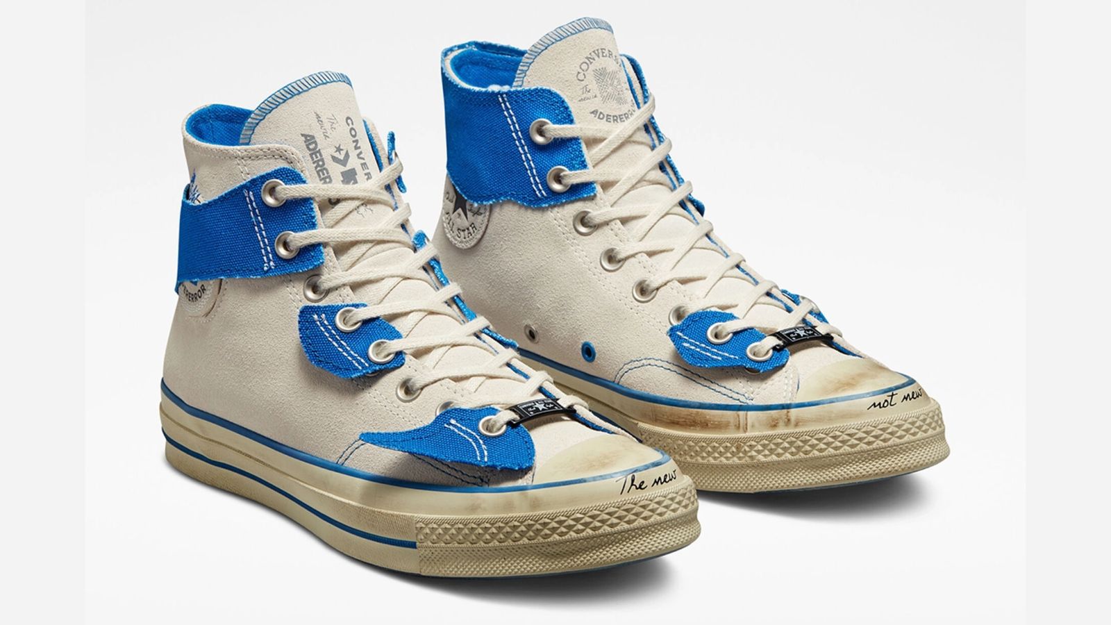 ADER error x Converse Chuck 70 Hi "The New Is Not New" product image of a white pair of sneakers with ripped blue overlays.