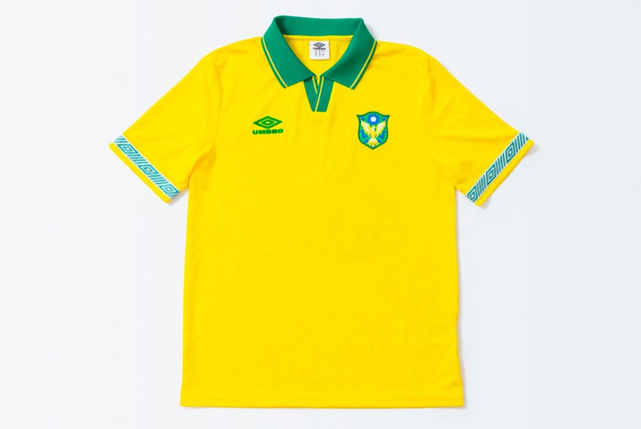 The Nations' Collection by Umbro product image of a yellow retro Brazil shirt with a green collar.