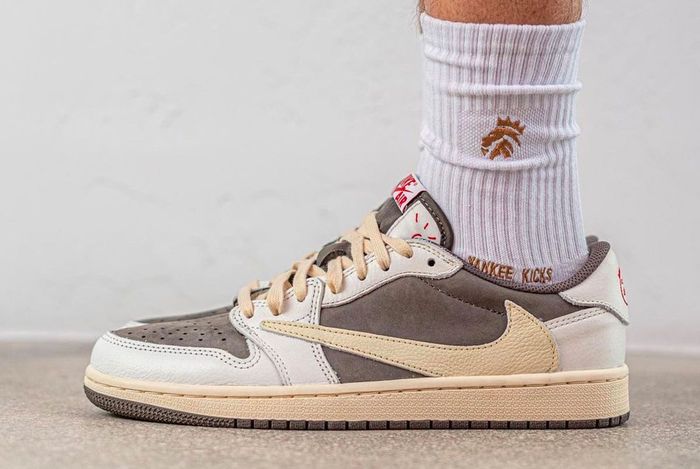 Travis Scott x Air Jordan 1 Low "Reverse Mocha" product image of a sail and brown suede pair of sneakers with reverse Swooshes.