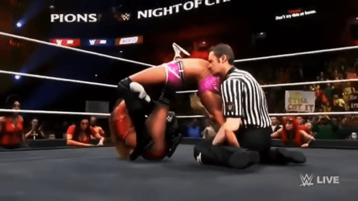 WWE 2K20 screenshot of a referee glitching into Charlotte Flair