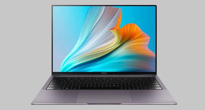 Best laptop for Football Manager 2022 HUAWEI product image of a dark grey laptop with an abstract blue and yellow image on its display.