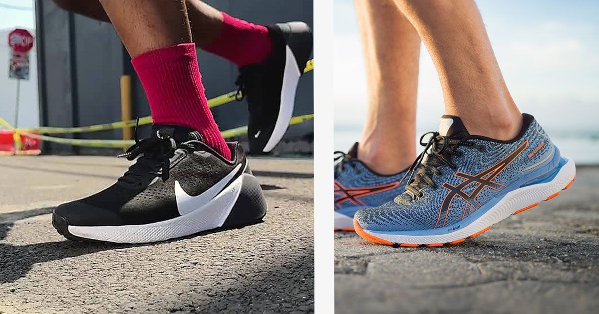 Someone in red socks wear a pair of black Nike shoes featuring white Swooshes on the left. On the right, someone in blue ASICS knitted shoes with black and orange details.