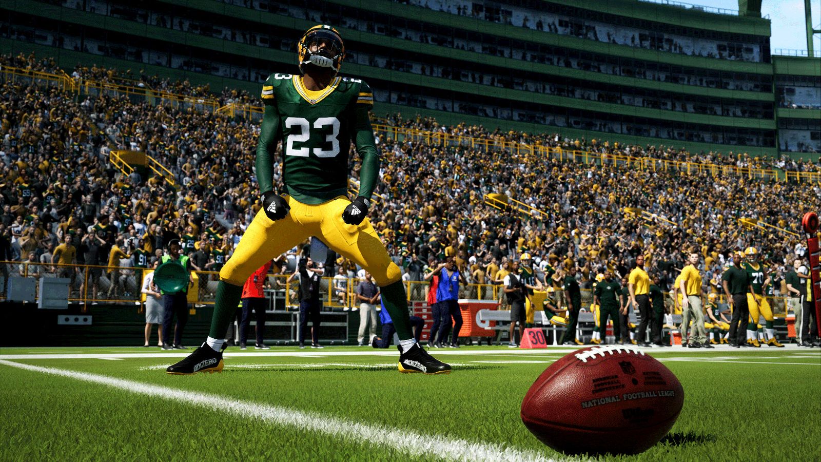 A shot of someone in dark green and yellow America Football gear about to kick a football in Madden 24.