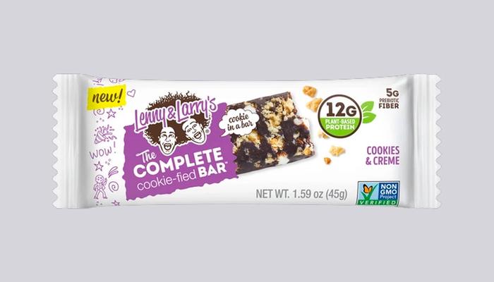 Best vegan protein bars Lenny & Larry's product image of a white package containing a cookies and cream falvoured bar.